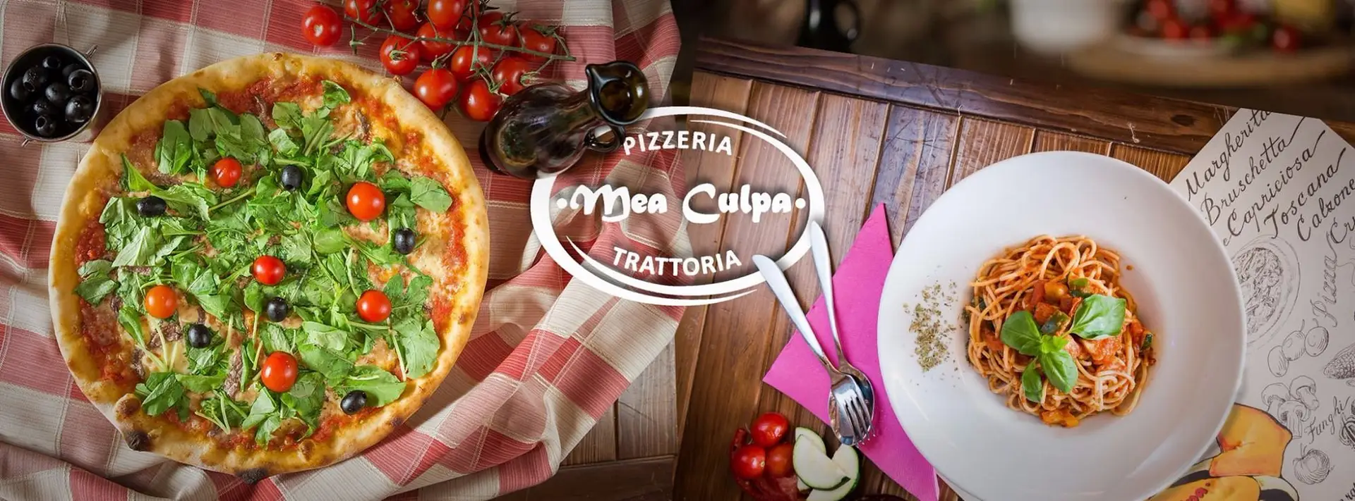 Pizza with toppings and spaghetti with tomatoes and olives at the table
