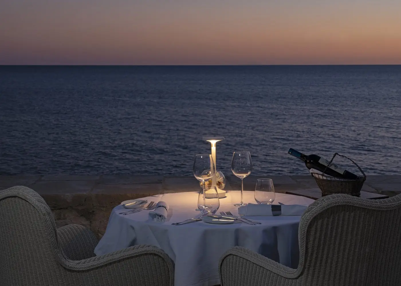 terrace of a restaurant overlooking at the sea at night
