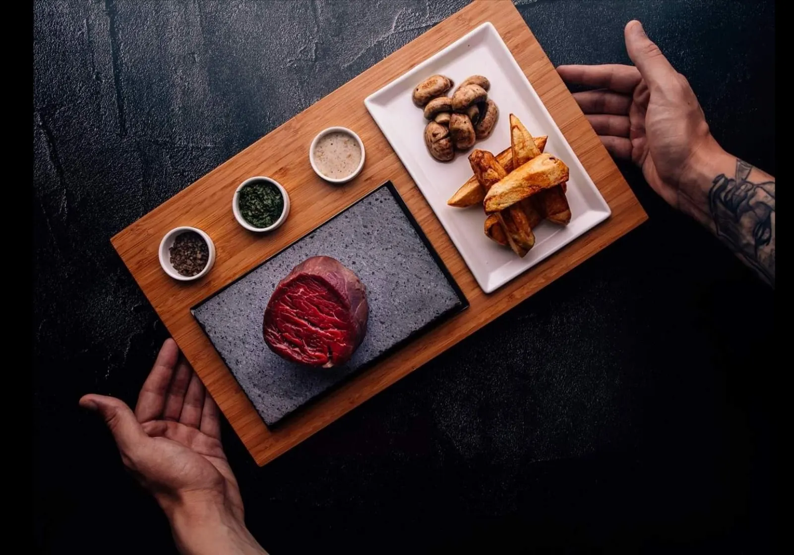 Meat, vegetables and souces at the table
