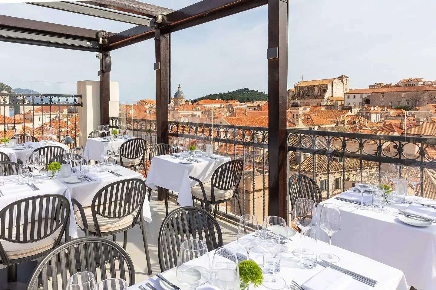 terrace of a restaurants with view of a terracotta roofs